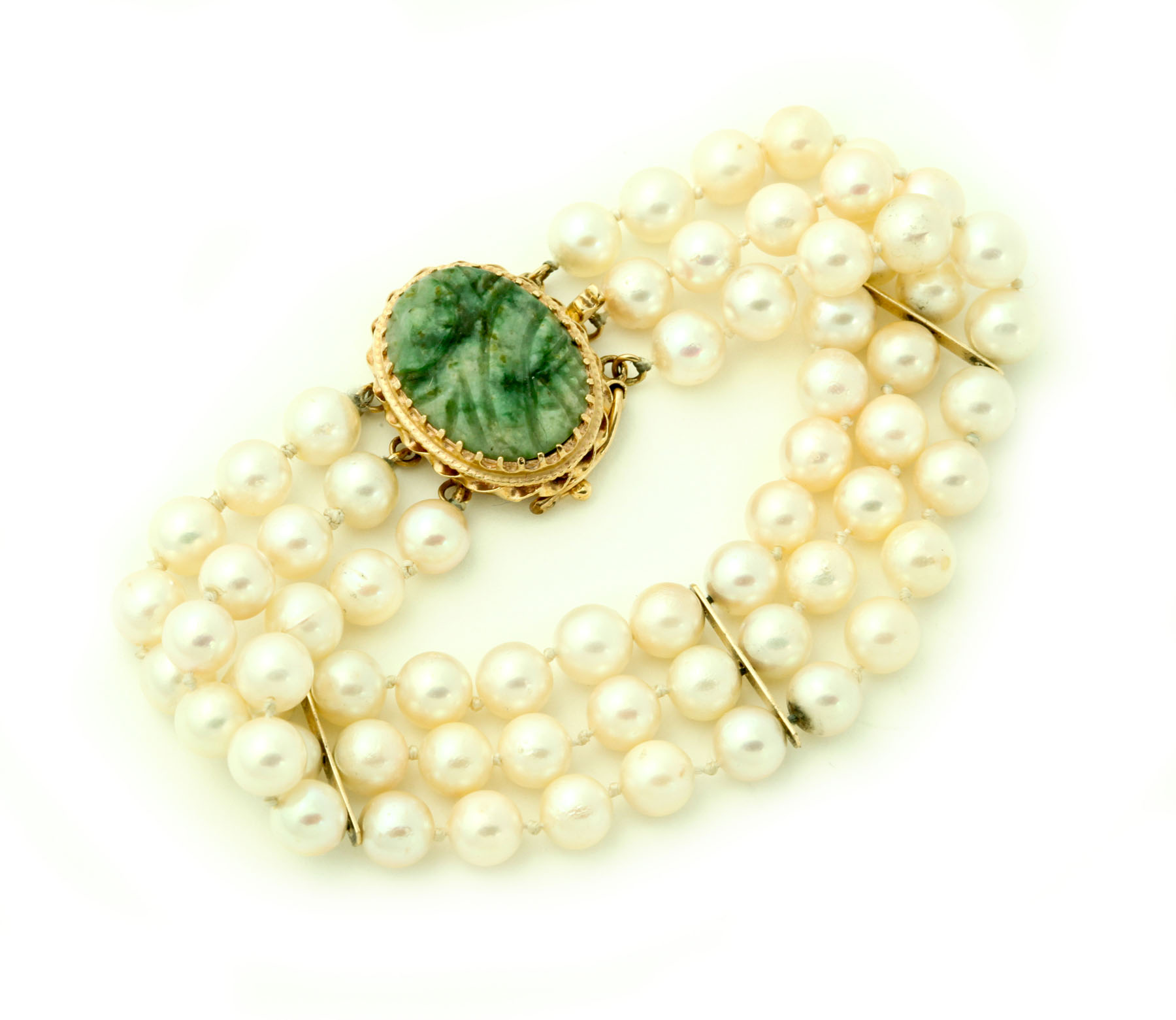 Appraisal: PEARL BRACELET Twentieth century Three-strand of sixty-six cultured mm pearls