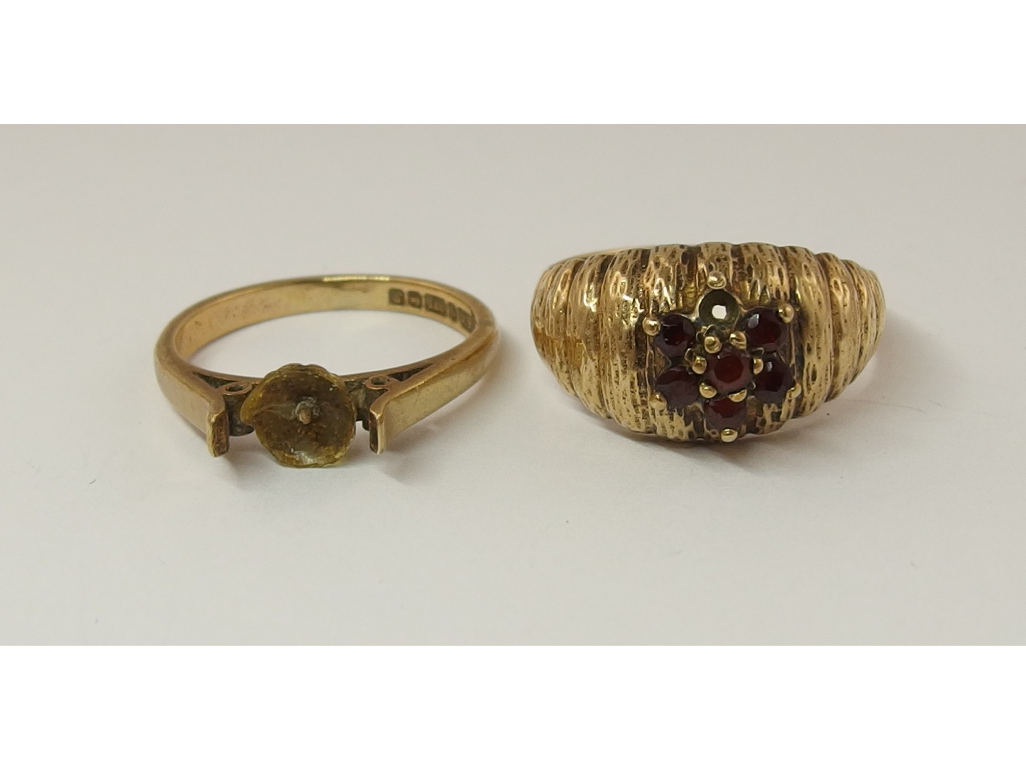 Appraisal: A ct garnet flower ring and a ct ring shank