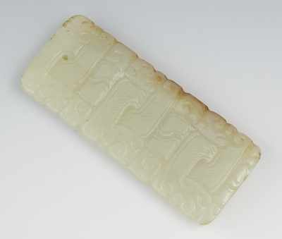 Appraisal: A Carved Jade Pendant The flat rectangular pendant is drilled