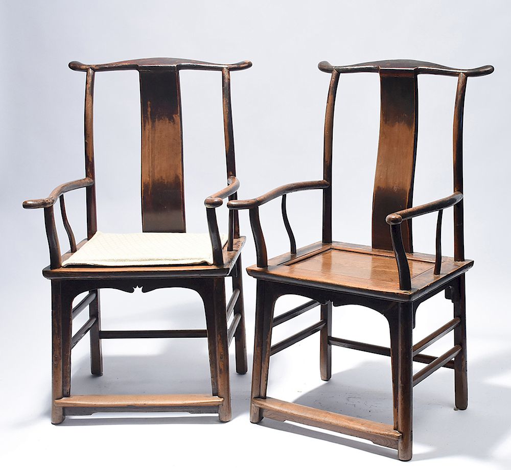 Appraisal: Pair of early Chinese yoke back armchairs in old color