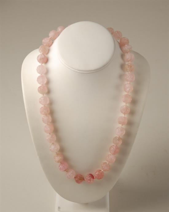 Appraisal: A Carved Rose Quartz Bead Necklace with a K marked