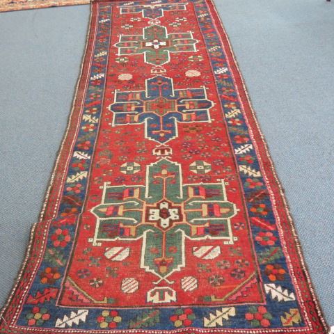 Appraisal: Heriz Persian Handmde Runner geometrics designs primarily reds blue ivory