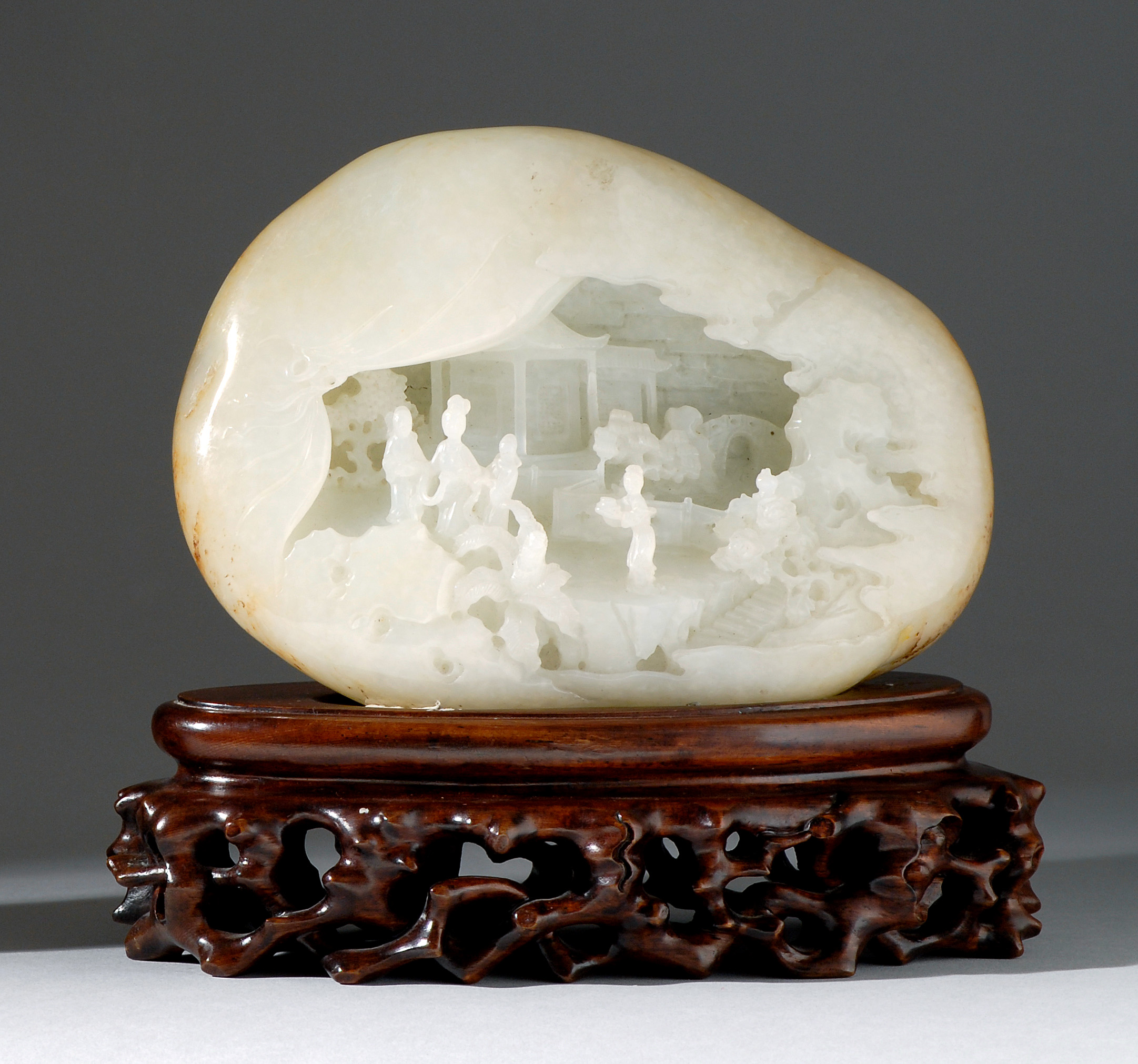 Appraisal: WHITE AND RUSSET JADE MOUNTAIN Early th CenturyIn boulder form