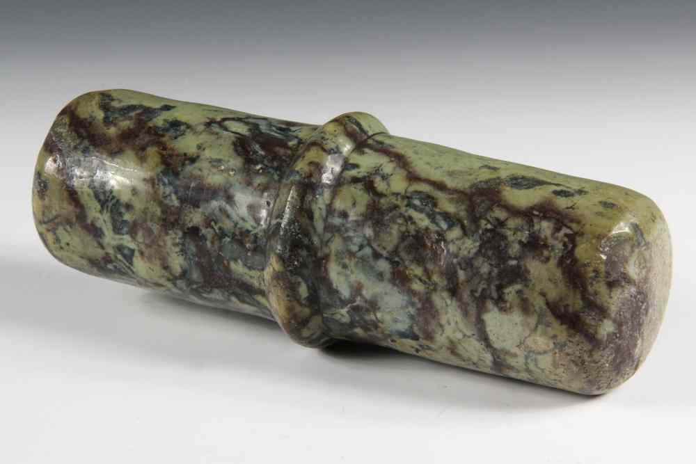 Appraisal: EARLY BACTRIAN STONE PESTLE- highly figured green stone cylinder with