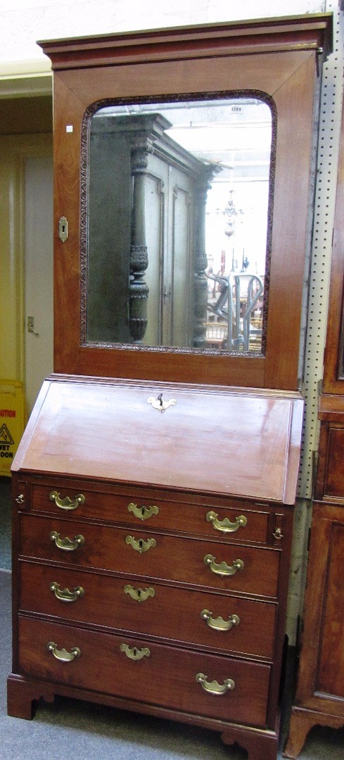 Appraisal: A small George III mahogany bureau bookcase the single mirror