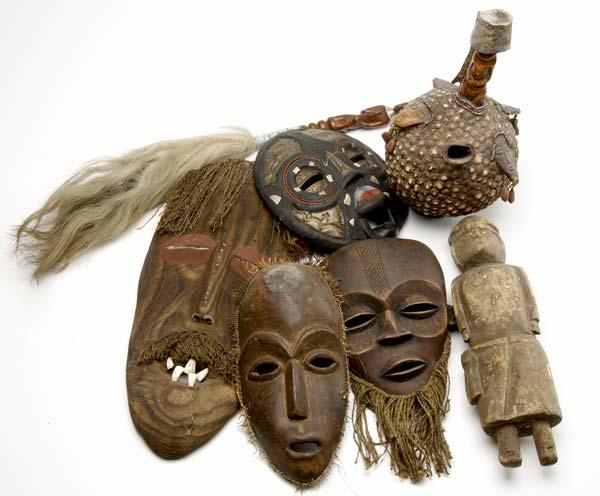 Appraisal: AFRICAN ARTIFACTS Seven items four masks gourd bottle with applied