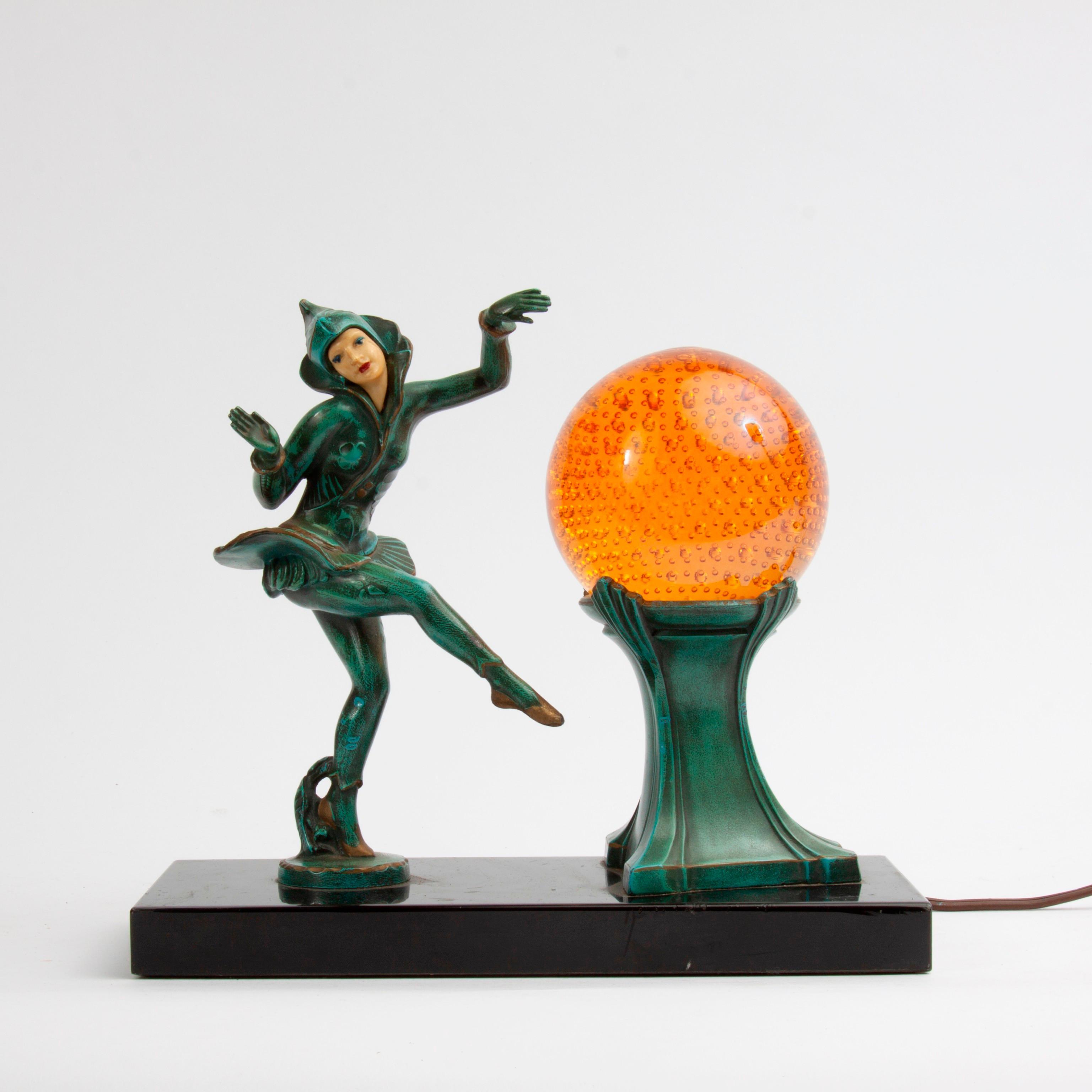 Appraisal: HARLEQUIN DANCER ART DECO LAMP A s Art Deco lamp