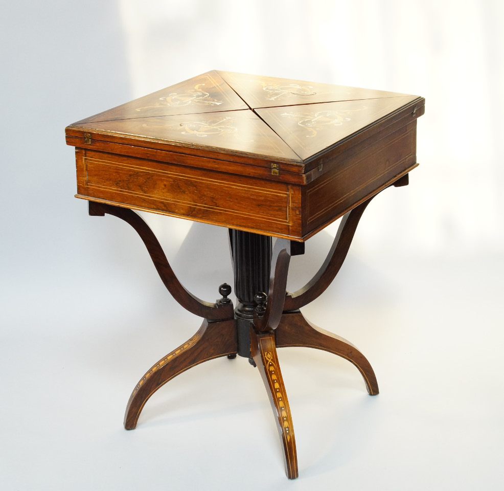 Appraisal: A late Victorian rosewood and marquetry envelope folding card table