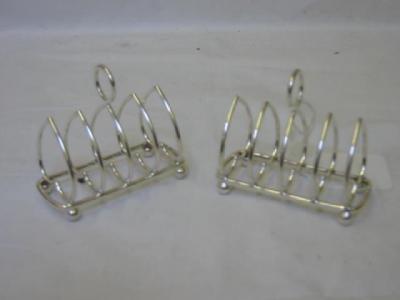 Appraisal: A PAIR OF TOAST RACKS of rounded oblong form each