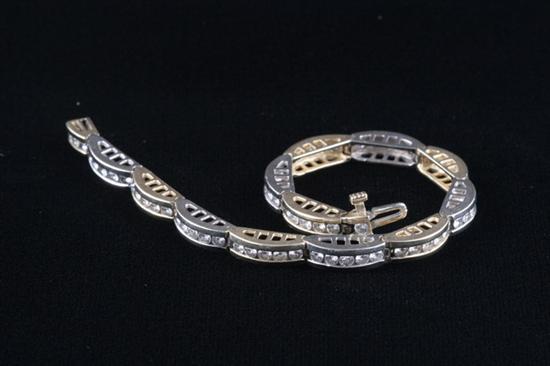 Appraisal: K YELLOW AND WHITE GOLD AND DIAMOND FLEXIBLE BRIDGE-LINK BRACELET