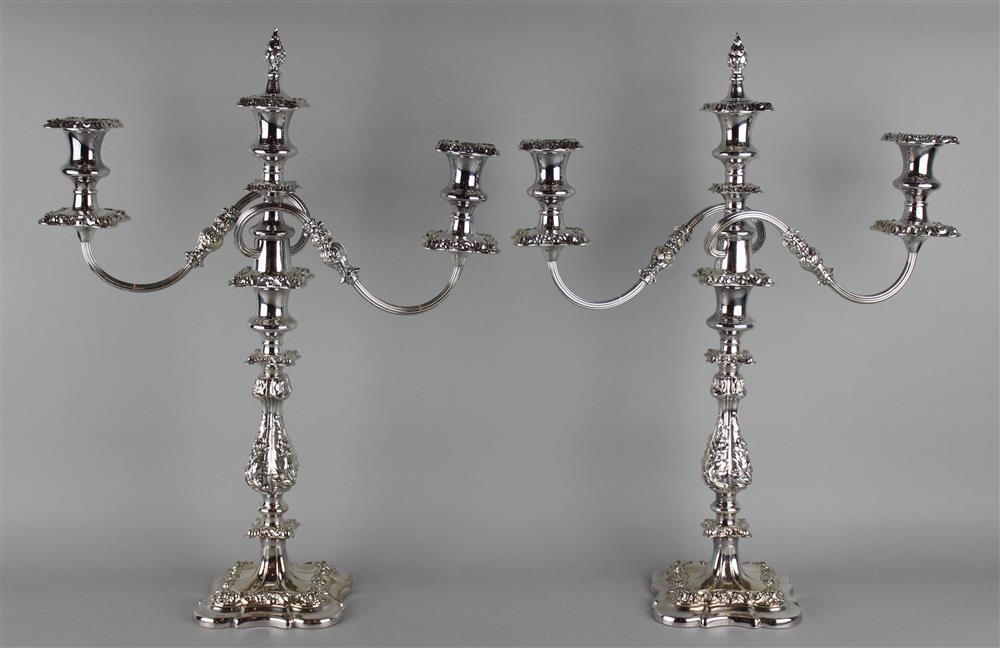 Appraisal: PAIR OF BARKER ELLIS SILVERPLATED THREE LIGHT CANDELABRA scallop shell