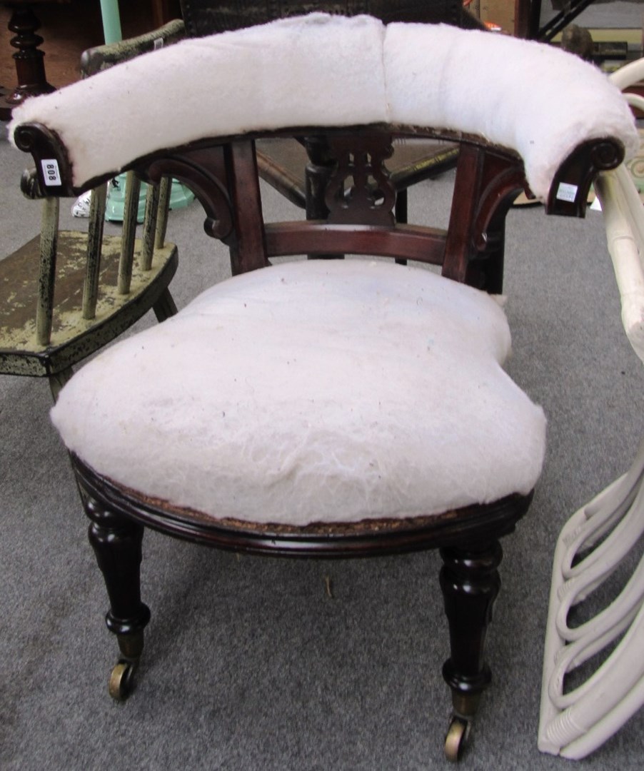 Appraisal: A Victorian mahogany tub back office chair on lappet turned