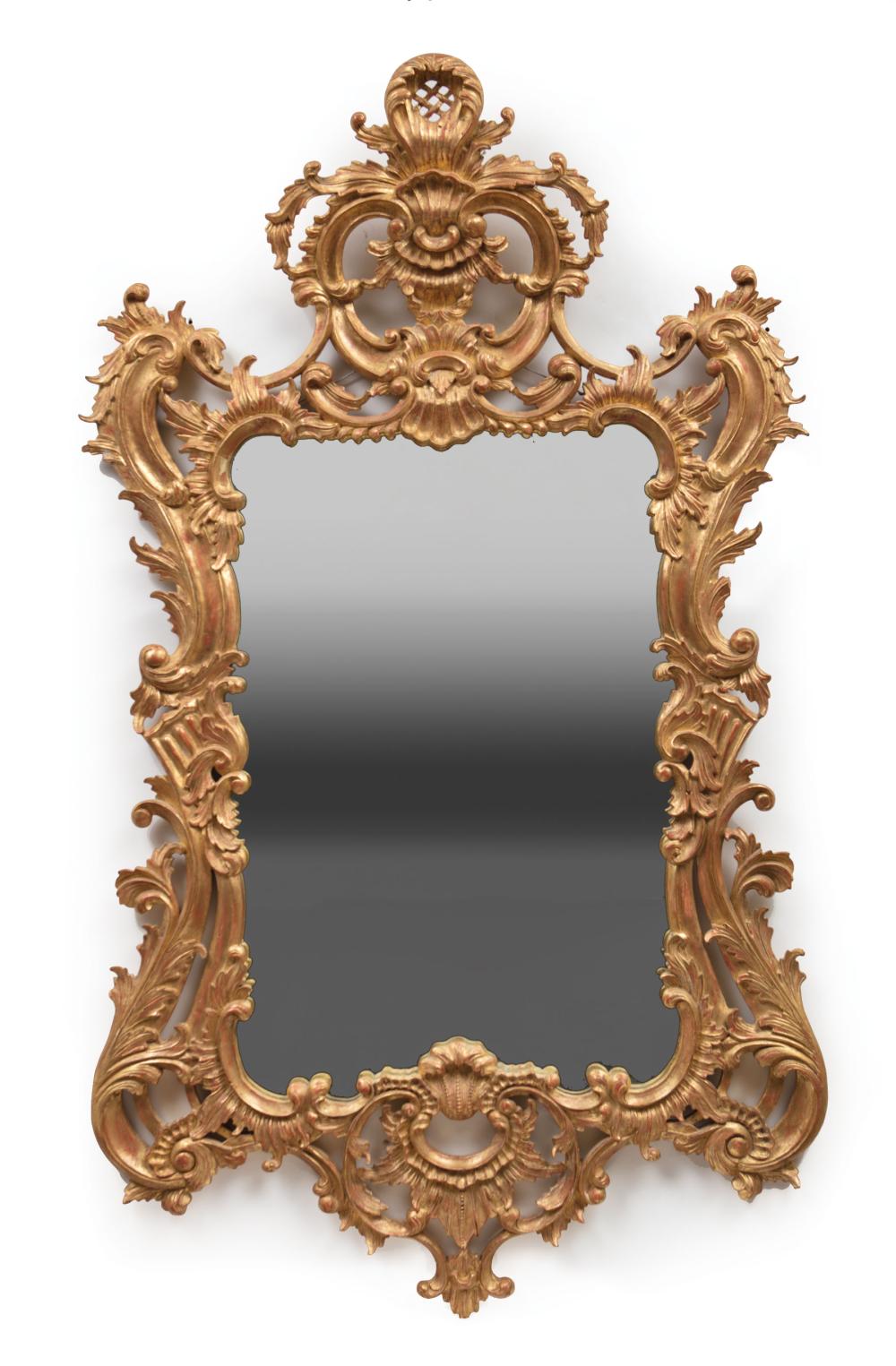 Appraisal: Continental Rococo-Style Giltwood Mirror foliate and shell motif scrolled surround