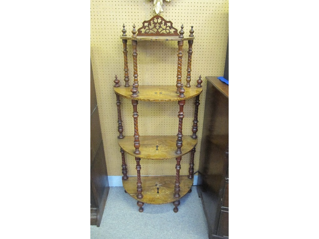 Appraisal: Victorian walnut inlaid four tier what-not