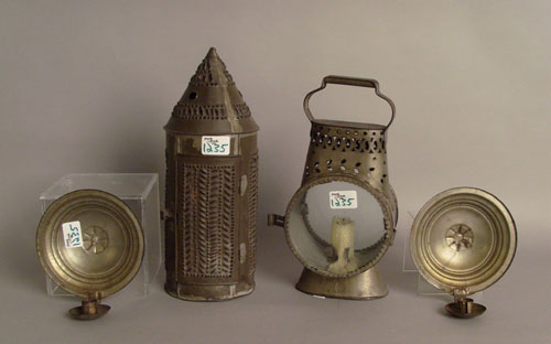 Appraisal: Tin lighting to include two lanterns and a pair of