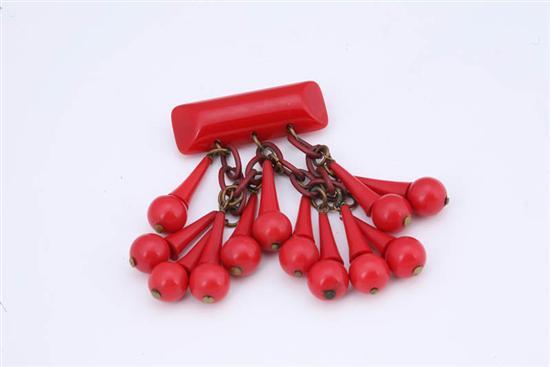 Appraisal: BAKELITE BAR PIN Red with red dangling sphere and cone