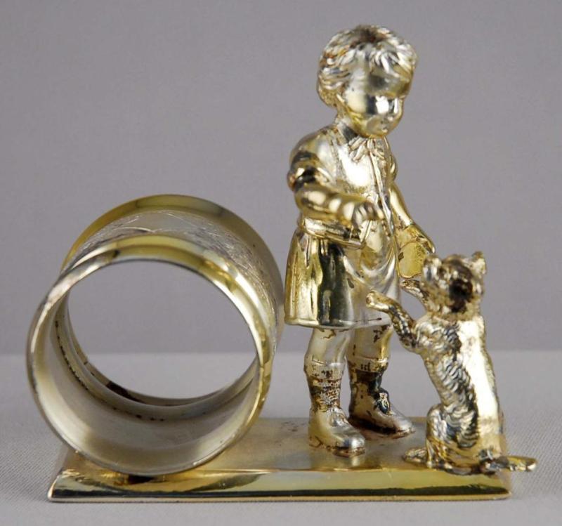 Appraisal: Figural Napkin Ring Meriden Boy with Dog Description Number re-silvered