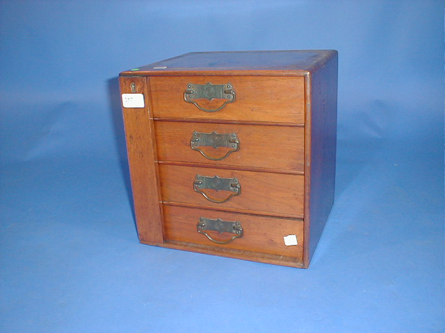 Appraisal: A Victorian walnut table cabinet with four Wellington locked drawers