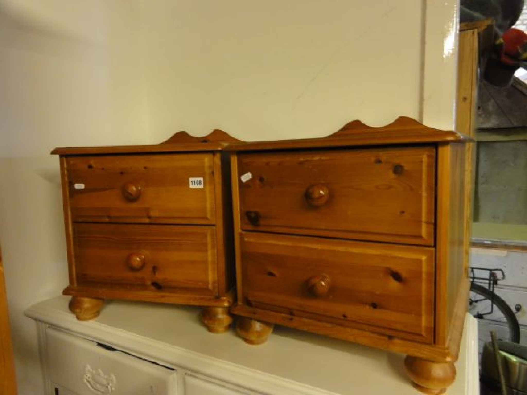 Appraisal: A pair of contemporary pine low two drawer bedside chests