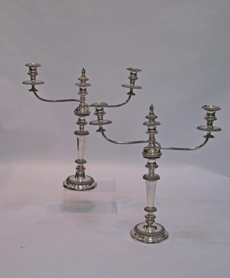 Appraisal: A PAIR OF TH CENTURY PLATE ON COPPER THREE-LIGHT CANDELABRA