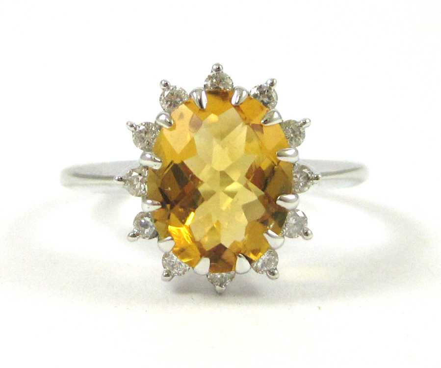 Appraisal: CITRINE DIAMOND AND FOURTEEN KARAT GOLD RING The white gold