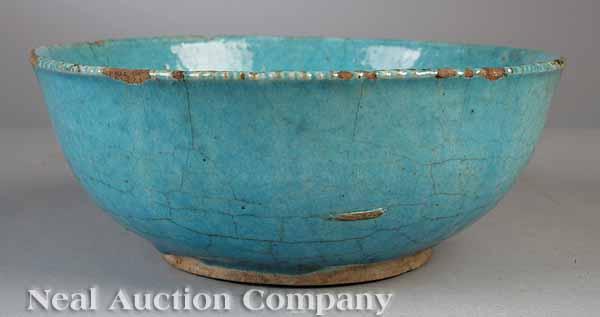 Appraisal: An Antique Turquoise Glazed Pottery Bowl possibly Kashan Central Iran