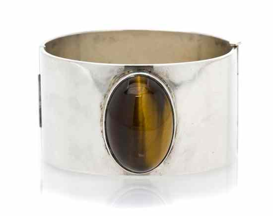 Appraisal: A Sterling Silver and Tiger's Eye Cuff Bracelet Kaunis Koru