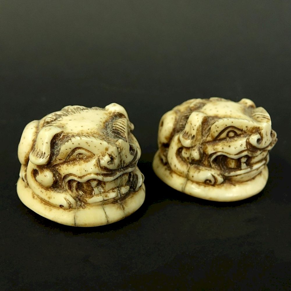 Appraisal: Pair of Japanese Carved Ivory Foo Dog Netsukes Pair of