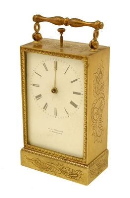 Appraisal: A continental gilt brass desk clock with repeat having a