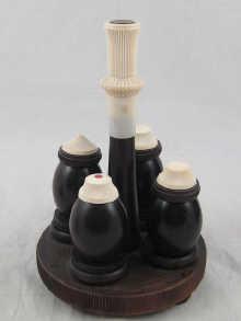 Appraisal: An ebony and ivory cruet set comprising stand and four