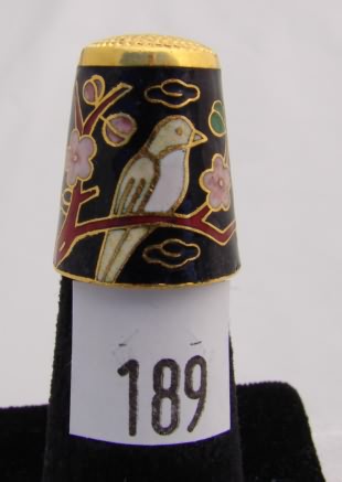 Appraisal: Cloisonne style thimble with cobalt interior doves