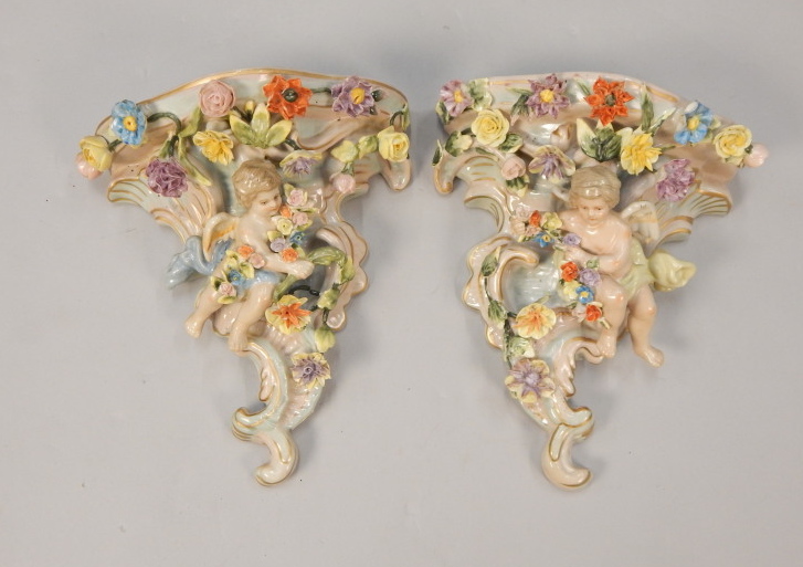 Appraisal: A pair of Sitzendorf type porcelain wall pockets each decorated