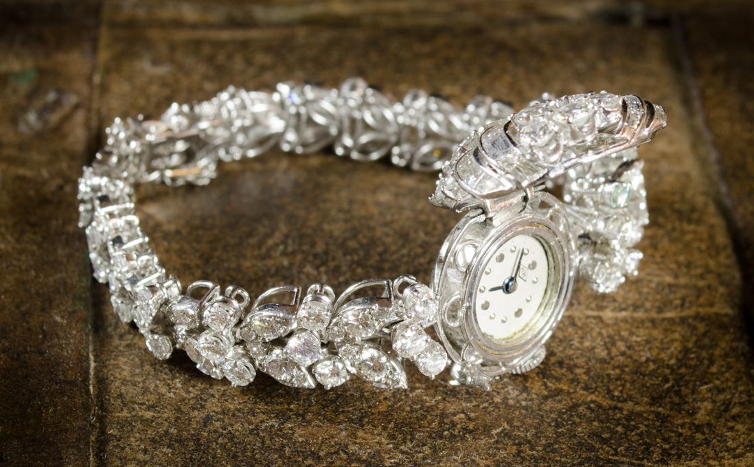 Appraisal: LADY'S ESTATE DIAMOND AND PLATINUM INTEGRAL BRACELET WRIST WATCH the