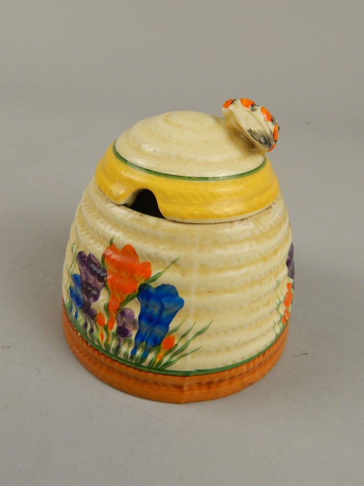 Appraisal: A Clarice Cliff Crocus pattern honey pot with typical ribbed