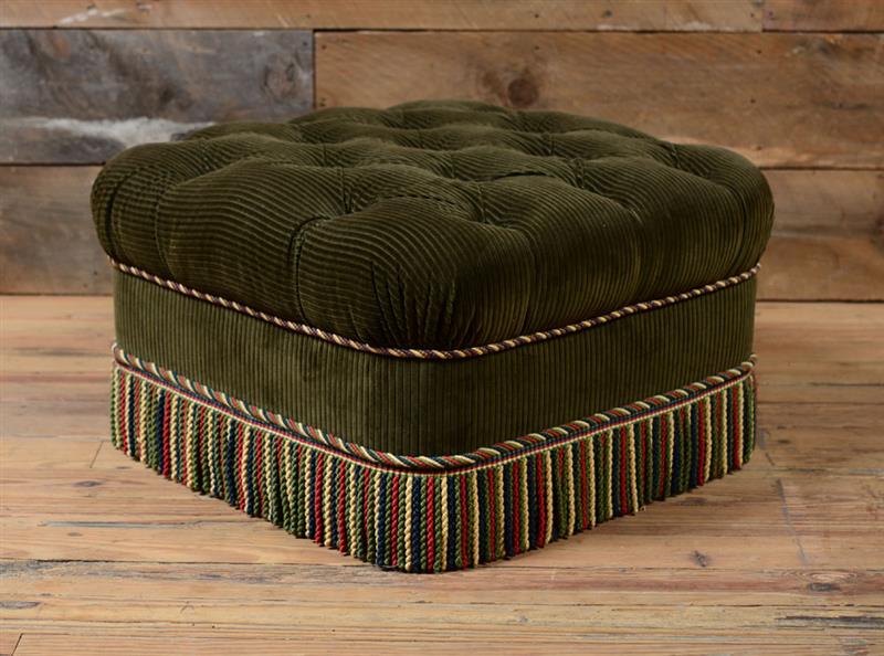 Appraisal: TUFTED UPHOLSTERED OTTOMAN Upholstered in olive green corduroy with multicolored