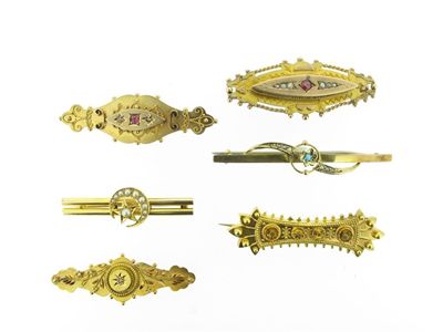 Appraisal: Four late Victorian gold Etruscan style brooches And two Edwardian