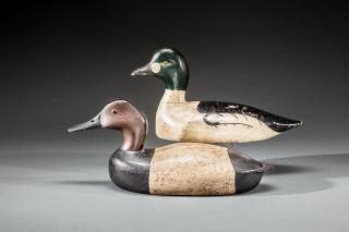 Appraisal: Two Decoys A hollow early-style canvasback by John McLoughlin -