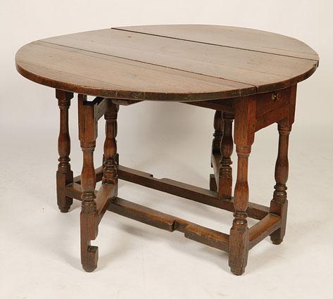 Appraisal: A CHARLES II OAK GATELEG DINING TABLE the shaped top