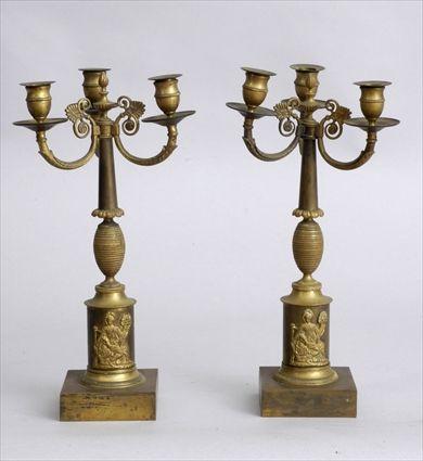 Appraisal: PAIR OF EMPIRE-STYLE GILT-BRONZE THREE-LIGHT CANDELABRA Each column with ovoid