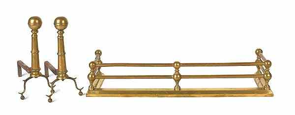 Appraisal: Pair of brass andirons h together with a brass fire