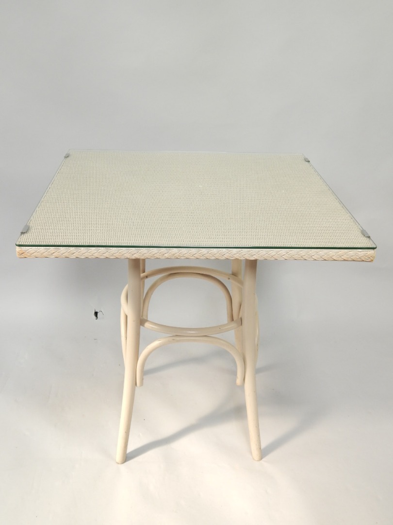 Appraisal: A Lloyd Loom square top table with plate glass top