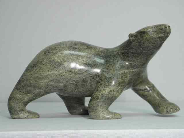 Appraisal: Nuna Parr carved stone Inuit sculpture depicting a walking polar