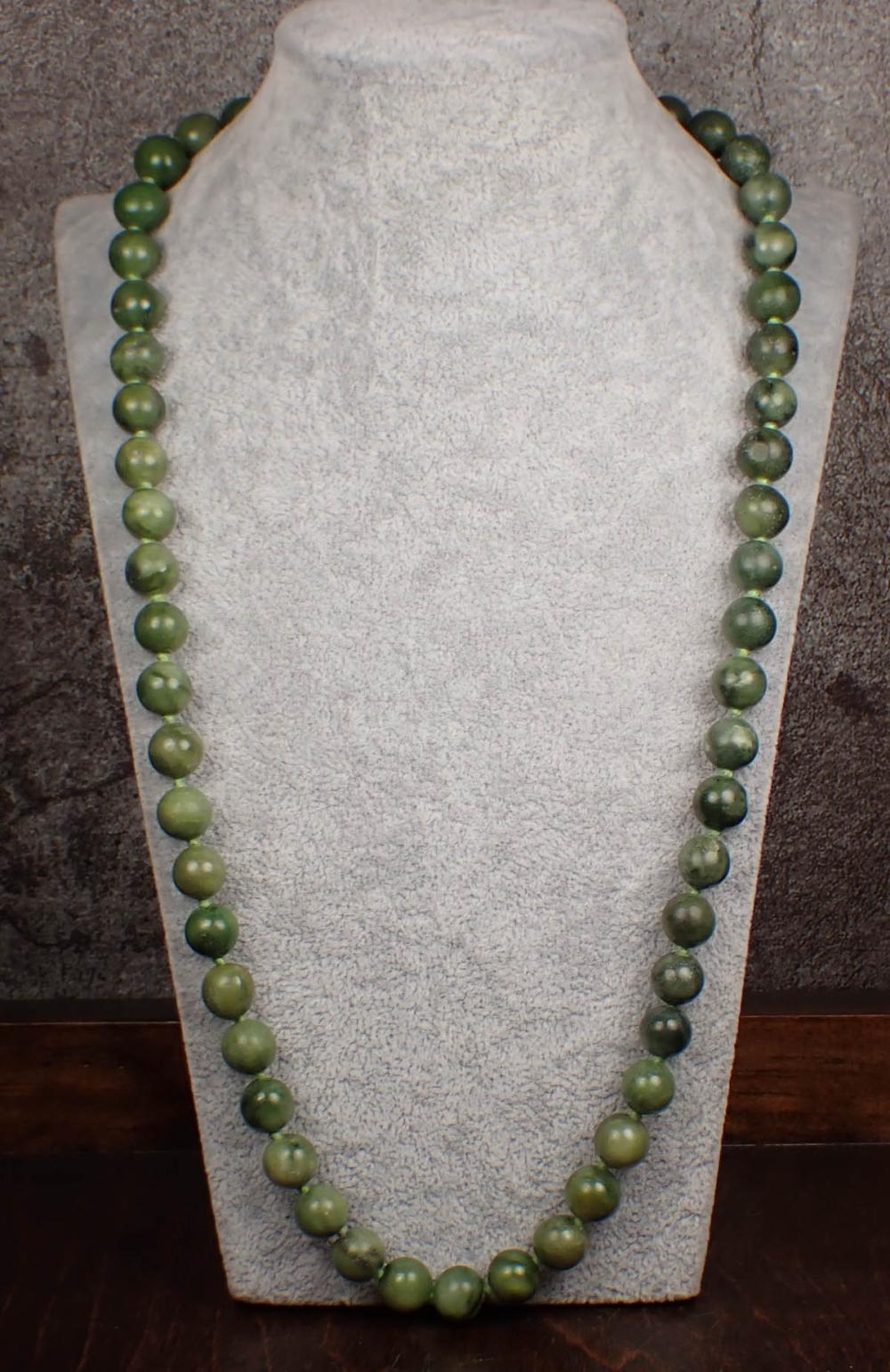 Appraisal: NEPHRITE JADE BEAD NECKLACE The - hand-knotted strand with nephrite