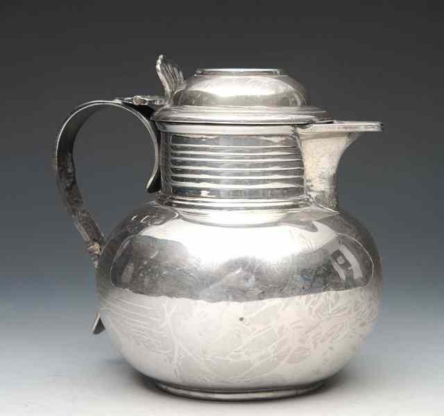 Appraisal: A SILVER LIDDED JUG with ovoid body ring turned neck