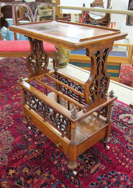 Appraisal: A VICTORIAN WALNUT CANTERBURY TABLE English third quarter of the