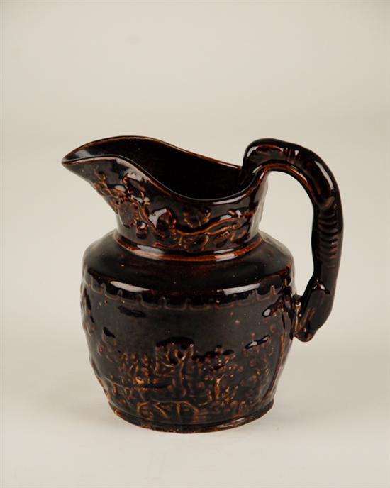 Appraisal: A Bennington Rockingham Pottery Pitcher glazed dark brown and having