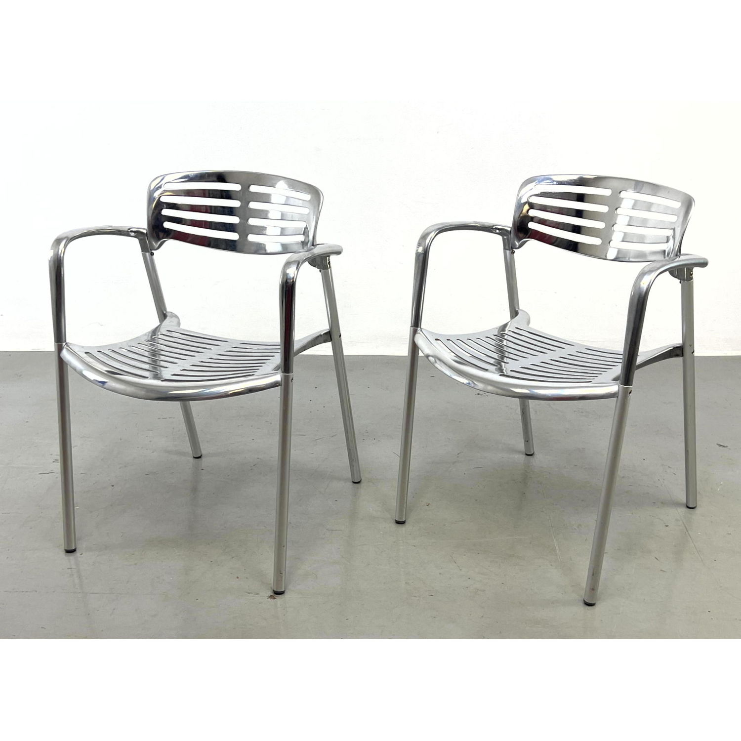 Appraisal: Pair Aluminum Arm Chairs In the style of Jorge Pensi