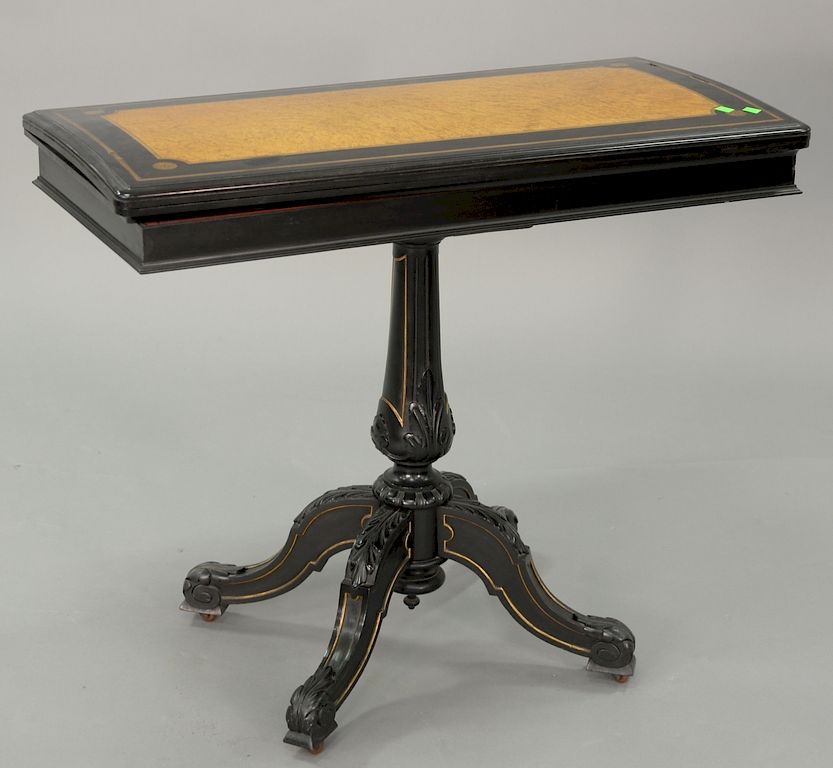 Appraisal: Classical game table ebony and inlaid satinwood top opening to