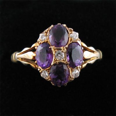 Appraisal: An amethyst and diamond cluster ring set in yellow gold