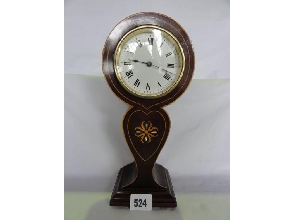 Appraisal: An Edwardian balloon shaped mantle clock with string inlaid detail